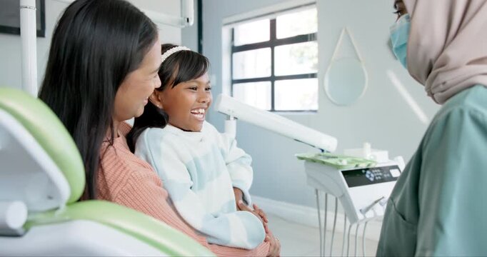 Child, pediatric dentist and high five in checkup, trust and good job for oral hygiene or healthy teeth. Girl, parent and support in consultation by orthodontist and congratulations for clean mouth