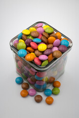 Colorful candies in sweet chocolate.
