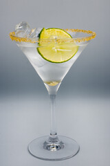 Alcoholic cocktail in a martini glass.
