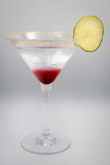 Alcoholic cocktail in a martini glass.
