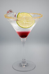 Alcoholic cocktail in a martini glass.
