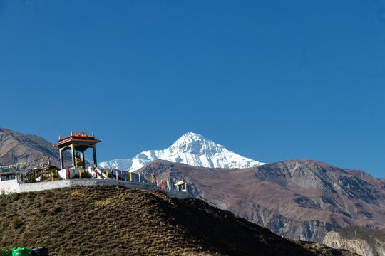 Statue of Siddhartha Gautam Buddha overlooking the Muktinath Village in Upper Mustang, Nepal