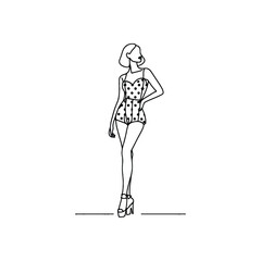 woman wearing retro fashion flirty polka dot romper with wedges