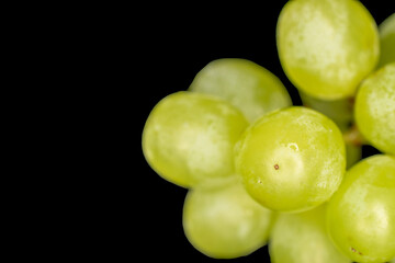 Sweet grapes, macro, isolated on black background.