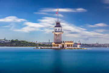 Fototapeta premium Tower like lighthouse on island in sea Postcard view Blurred clouds, smooth water, Istanbul, Turkey