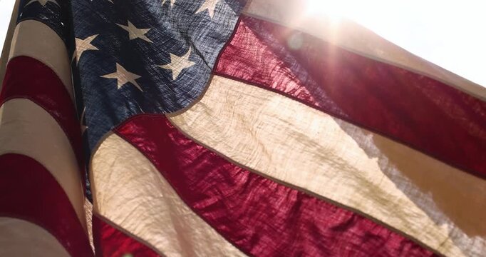 National Flag of the USA waving in the wind slow motion. Memorial Day