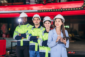 A group of people wearing safety gear. Worker industry join hand for collaboration.