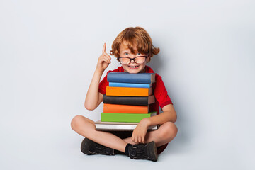 Schooler with books ready for school - big dream for the future. Develop idea concept.