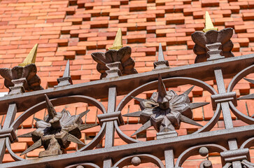 Forged iron fence and brick wall