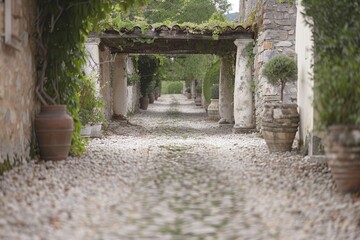 Naklejka premium Elegant garden pathway with a stone pergola and lush greenery, captured in soft daylight, showcasing the serene atmosphere and inviting setting.