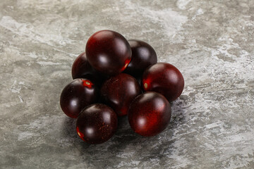 Raw ripe black kumato tomato