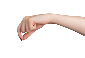 A hand with fingers pinching a small, invisible object. The gesture, made by a woman with elegant...