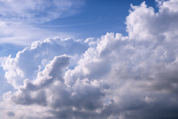 Cumulus white clouds on a sky-blue vault. Abstraction. Wallpaper