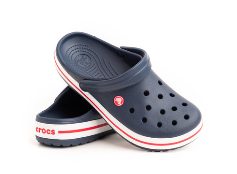 Istanbul, Turkey - July 28, 2024: Crocs Crocband Clog on white background. Navy blue color Crocs slipper.