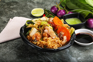 Asian cuisine - Fried noodles with seafood