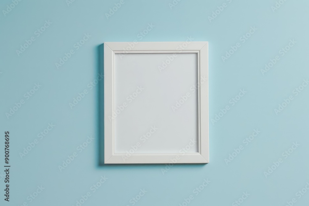 Poster empty white picture frame on a soft blue background, showcasing a simplistic and clean design
