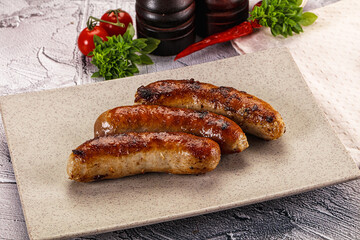 Delicous natural roasted sausages in the plate