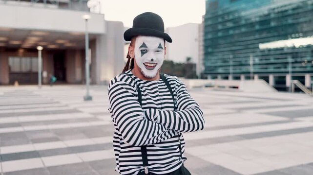 City, emotion and face of mime for funny joke, humor and crazy facial expression with crossed arms. Theatre, street performer and portrait of man in costume for performance, entertainment and comedy