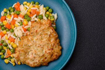 Delicious boiled rice with vegetables or risotto with carrots, peas and corn