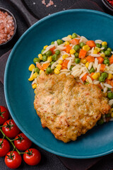 Delicious boiled rice with vegetables or risotto with carrots, peas and corn