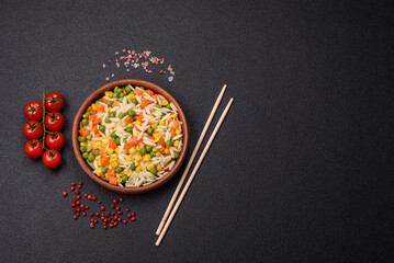 Delicious boiled rice with vegetables or risotto with carrots, peas and corn