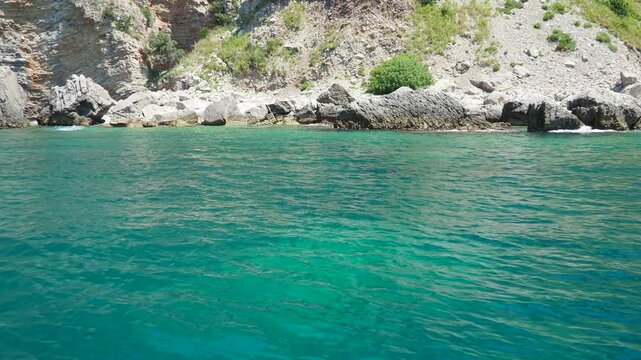 Cave Pecin bay between Petrovac - Sutomore. Hills, inaccessible rocks. Montenegro Flysch, marine sedimentary rocks, lithological layers. Adriatic Mediterranean sea Vezirova Ratkova Plaza, Budva