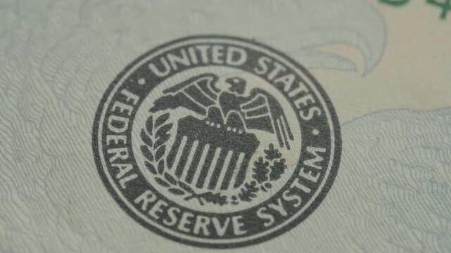 United States Federal Reserve System seal on US Dollar Bill close up macro shot.