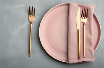 Pink Plates and Gold Flatware on White Table