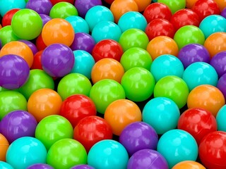 Colourful balls in a ball pool. Close view. Multi-coloured background
