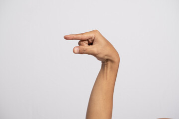 Deaf alphabet letter Q by hand. Letter 'Q' in sign language, isolated on a white background. Hand...