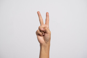 Deaf alphabet letter V by hand. Letter 'V' in sign language, isolated on a white background. Hand gestures. hearing impairment. languages ​​that use visual manual modality. deaf signs.