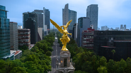 Obraz na płótnie Canvas Mexico City, Mex. June 29, 2024: Iconic Angel of Independence, the monument stands majestically in the middle of Reforma Avenue. It symbolizes freedom and in the heart of the Mexican capital.