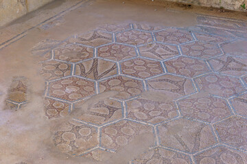 Ancient mosaic in ruin of the ancient roman quarter in the Valley of the Temples on a sunny spring day, Agrigento, Sicily, Italy