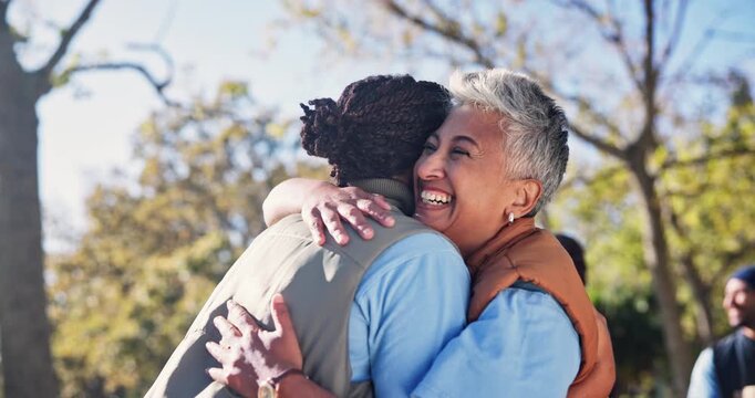 Happy woman, volunteer and nature with hug for community service, embrace or love together at park. Female person, friends or team with smile for support or difference in NGO, partnership or unity