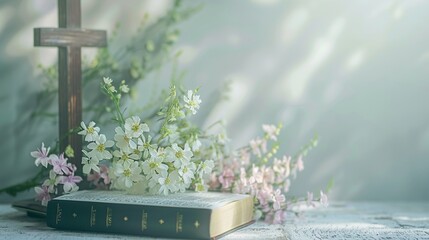 Wooden cross next to bible and flowers bouquet on wooden table against widow light, with copy space.