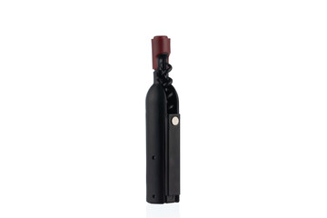 Fototapeta premium Modern black corkscrew and bottle opener with a sleek design, isolated on a white background. Elegant wine bottle-shaped corkscrew and opener combination. 