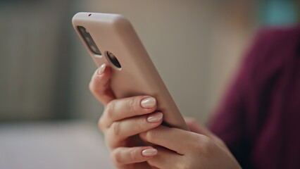 Woman hands using smartphone tapping screen closeup. Manager browsing cellphone