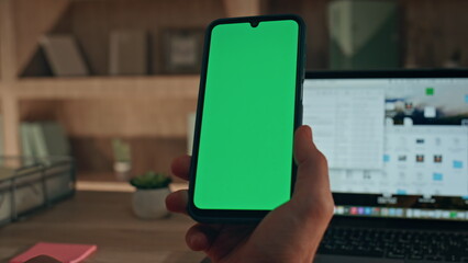 Online customer using mockup smartphone for shopping at home office close up.