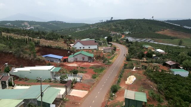 rural road with little traffic passing through small towns in montana vietnam
