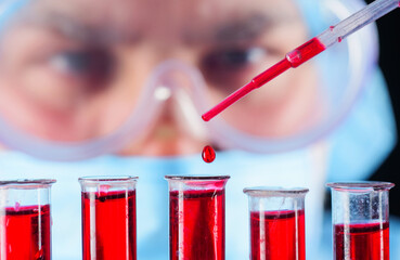 Blood test. Doctor working with patient's blood sample in lab. Detection of antibodies. Serological...