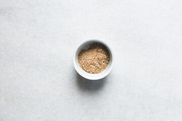 Overhead view of ground dried crayfish, top view of dried shrimp powder, flatlay of nigerian crayfish powder on a white background