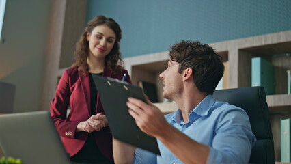 Ceo signing documents secretary working together at company coworking close up.