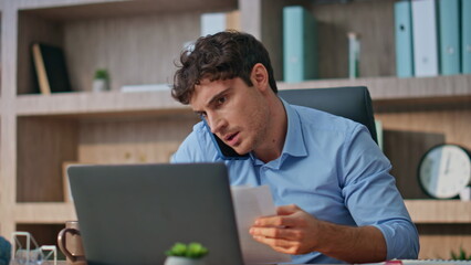 Man entrepreneur negotiating call in office closeup. Busy sales manager consult