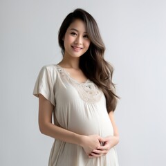 A woman is wearing a white dress and smiling