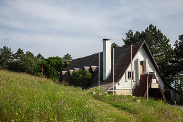 Abandoned hotel building in a state of disrepair, highlighting architectural decay and urban abandonment.