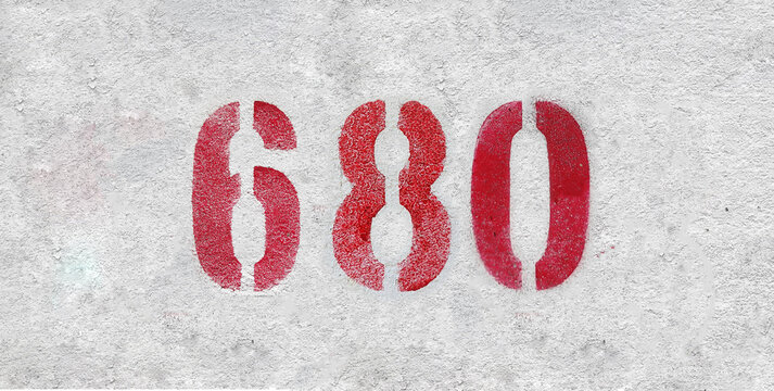 Red Number 680 on the white wall. Spray paint.