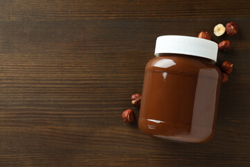 Chocolate paste with nuts on a dark background