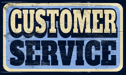 Aged and worn customer service sign on wood