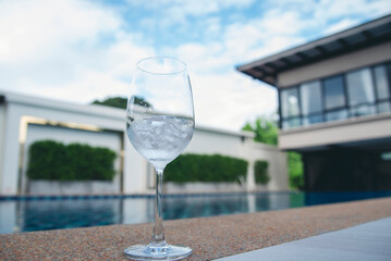 Poolside background Blue swimmimg pool reflection ripple wave underwater. Turquoise paradise shiny outdoors party in luxury hotel. Summer Outdoors lifestyle tourist vacation background swimming pool