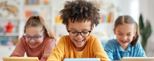 Fototapeta premium Group of happy kids using tablet devices for learning and playing. Educational concept with children enjoying technology indoors.